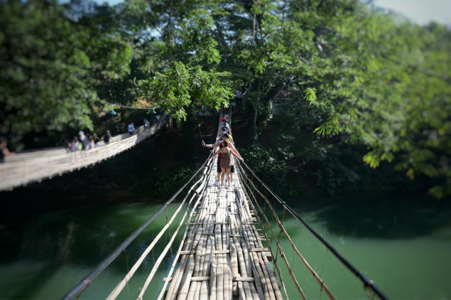 Walking on the hanging bridge in Bohol