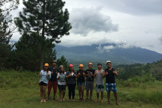 Happy guests taking at a scenic view in Davao