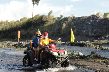 Happy guests of e-Philippines riding an ATV in Albay, Bicol